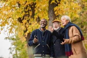 Three senior men out on a fall walk